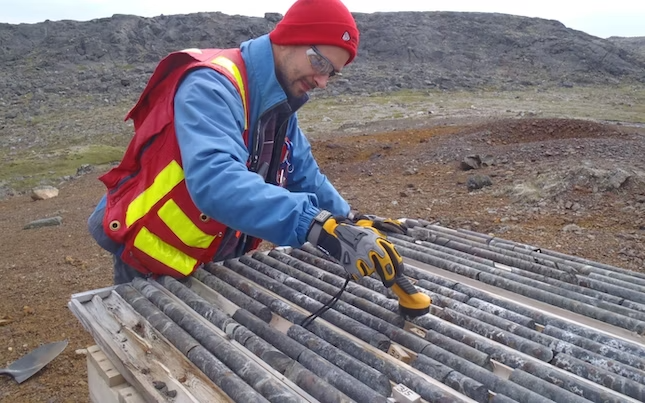 Man looking at drill core